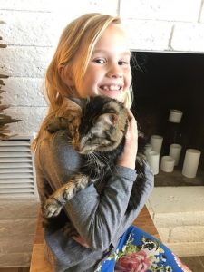 Eight-year-old girl loves blind rescue cat