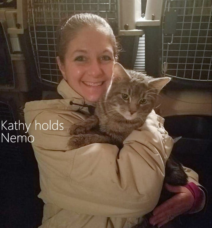 Kathy holds Nemo one of the cats found