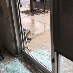 Shattered glass of front door of animal shelter
