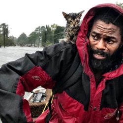 Robert Simmons and kitten rescued from flooding in N. Carolina