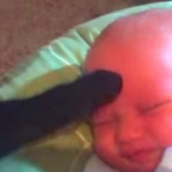 Cat calms crying baby with his gentle touch