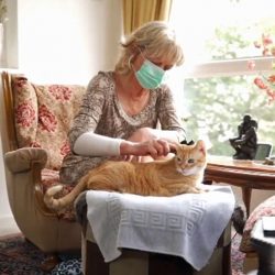 Christiane Panis is so allergic to cats that she usually wears a mask when she combs her cat’s fur.
