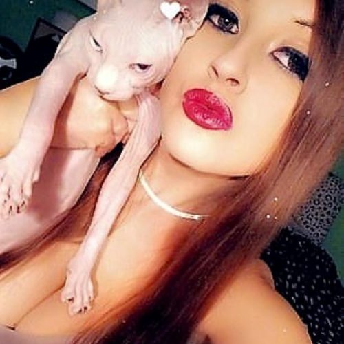 Bramhall with one of her cats; a Sphynx