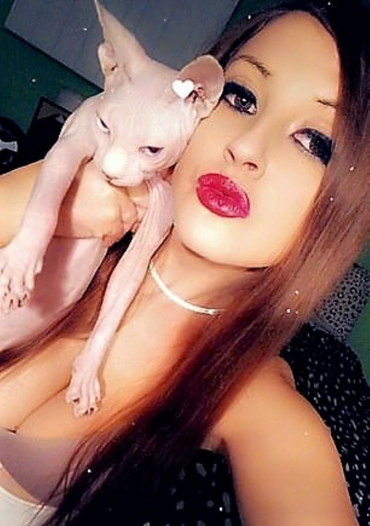 Bramhall with one of her cats; a Sphynx