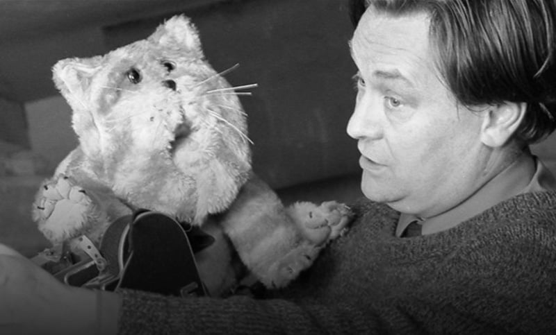 Oliver Postgate being advised by Bagpuss in the studio, 1974