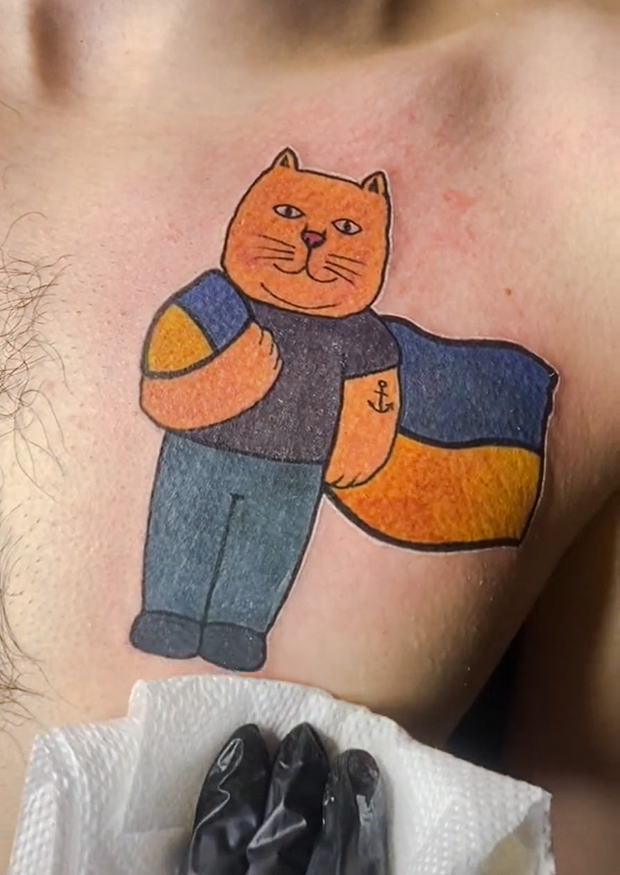 Cat tattoo on Ukrainian signalling defiance