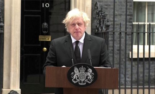 Johnson in mourning wearing a black suit and tie during his resignation speech outside No 10