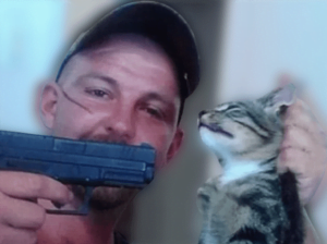 Picture of a man holding his cat by the scruff of the neck and pointing a gun at their head
