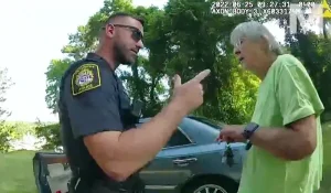 Beverly Roberts shortly before her arrest. The police officer in the picture is one of those being sued for compensation. I bet he did not foresee that development. Good for Roberts. The power of women particularly elderly women. This is a body cam image from another police officer who was there.