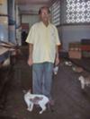 Mr Atam Wadhwani, the cat philanthropist with lucky survivor cat Rajesh in the Worli fish market of Mumbai.